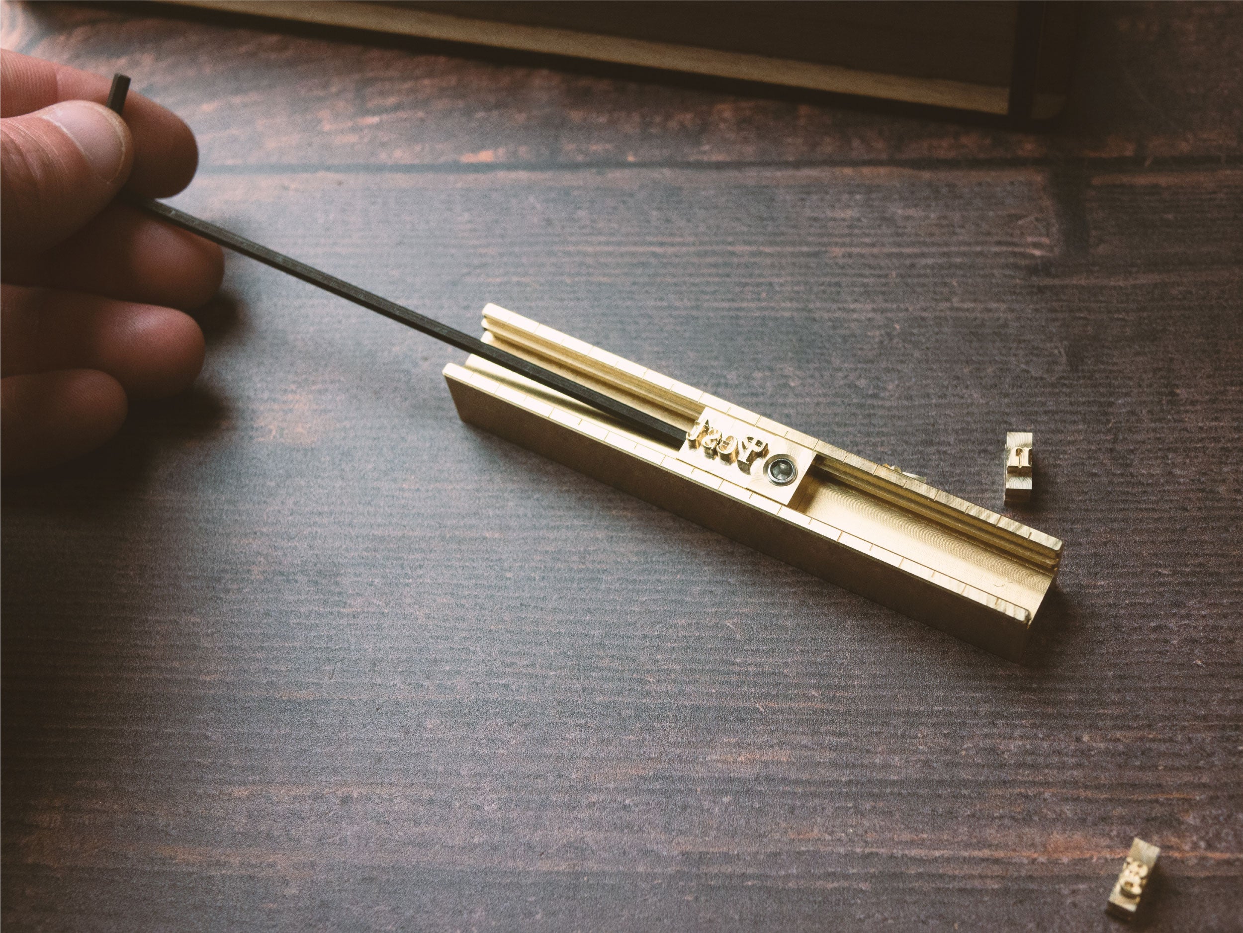 Inserting Letters into Alphabet Letter Stamp Set Rail - Outpost Workshop