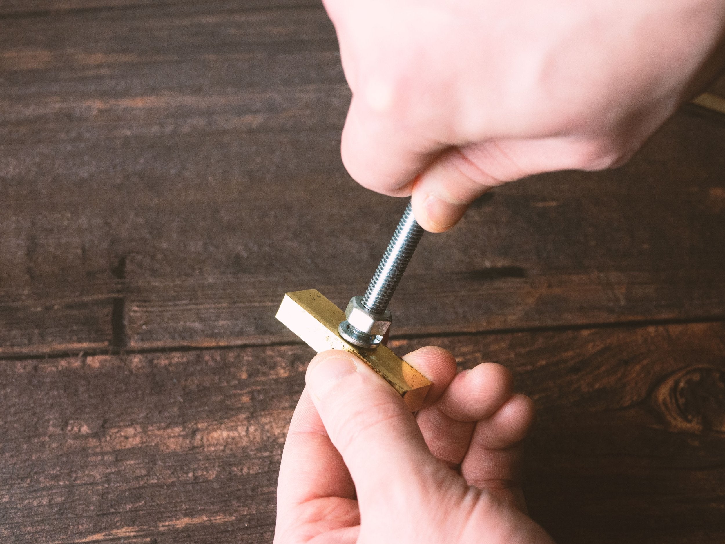 Screwing Leather Embossing Stamp into Handle - Outpost Workshop