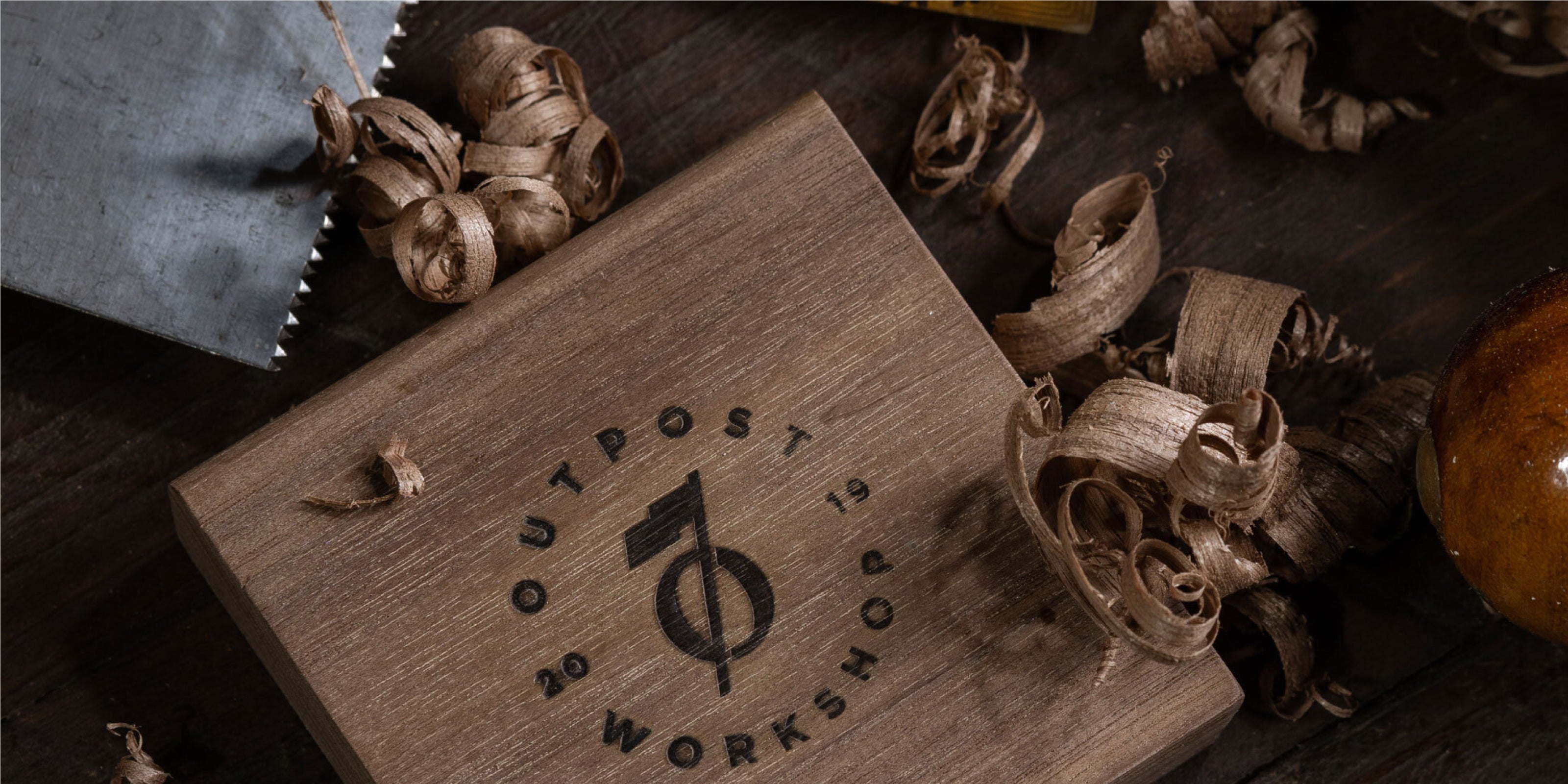 Outpost Workshop Logo Branded into Wood